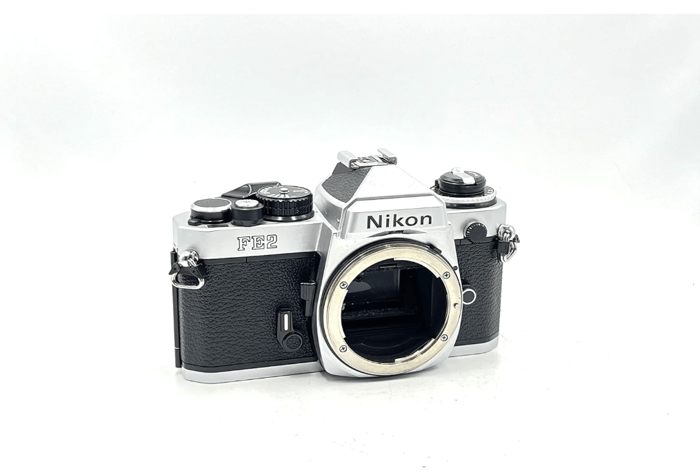 
Nikon FE2 film SLR camera with chrome body; no lens