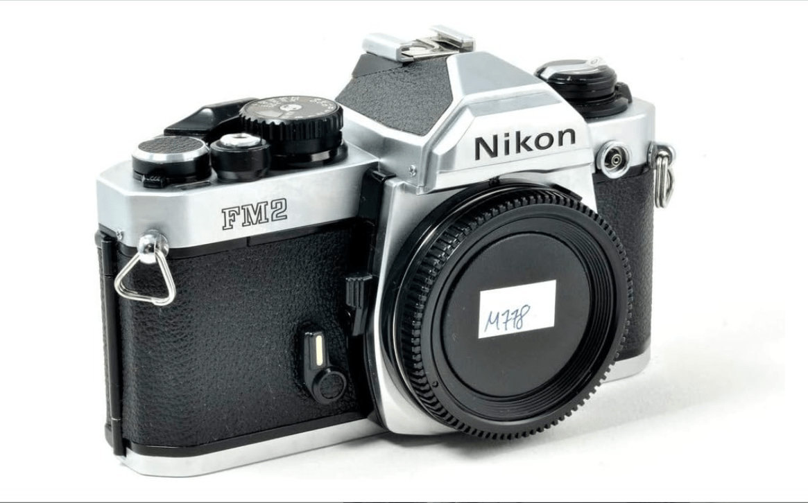  Nikon FM2 35MM SLR Film Camera with Titanium Shutter Manual focus FX Nikon Lens system (Renewed)