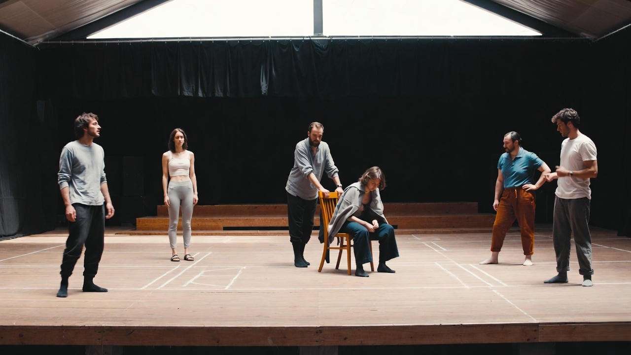Original practices Shakespeare rehearsal on thrust stage with minimal props and chalk blocking