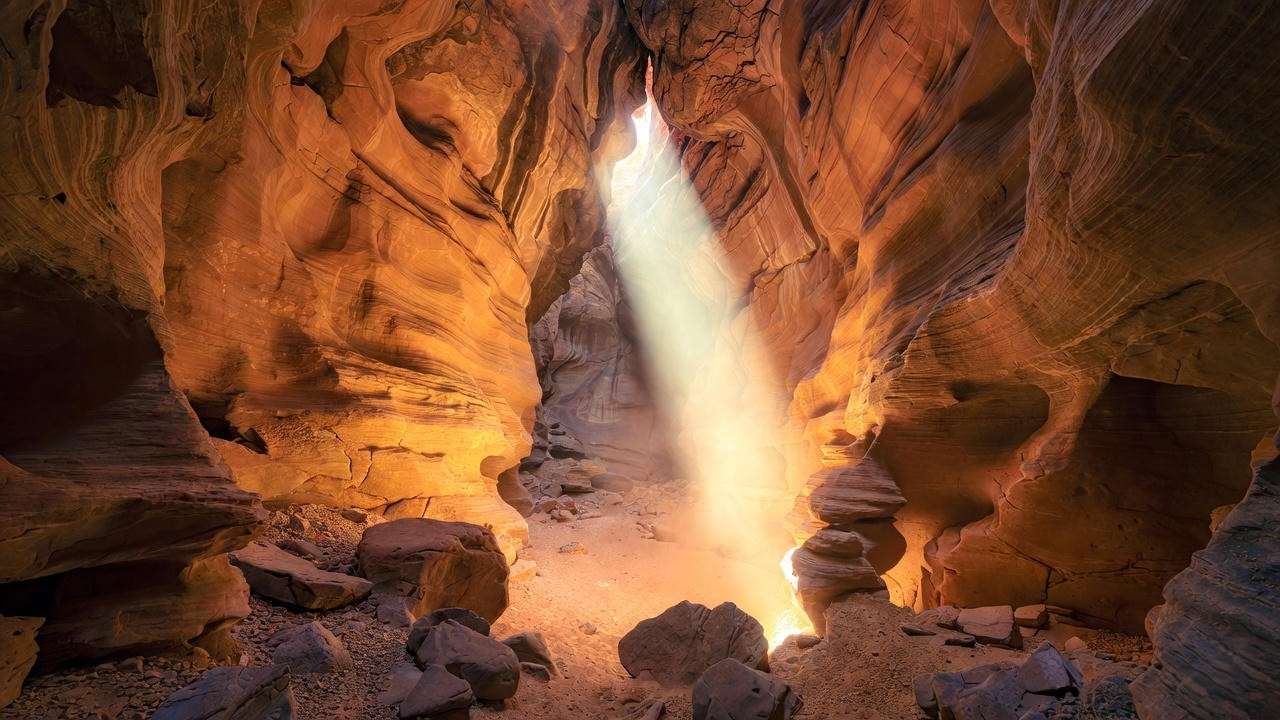 Hidden Arizona slot canyon light beam representing wonder rift AZ discovery