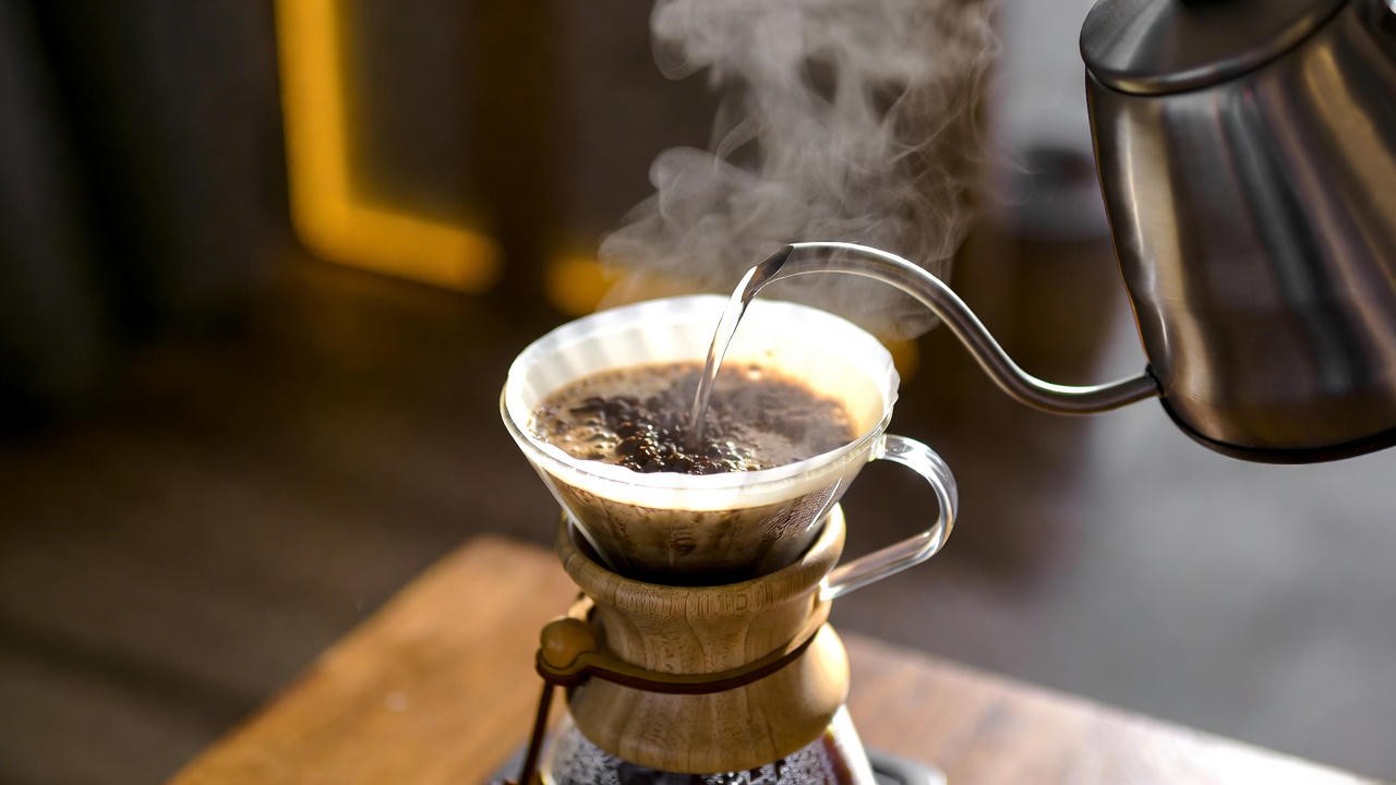 Pour-over brewing of Romeo and Juliet Colombian coffee highlighting bright floral and berry notes