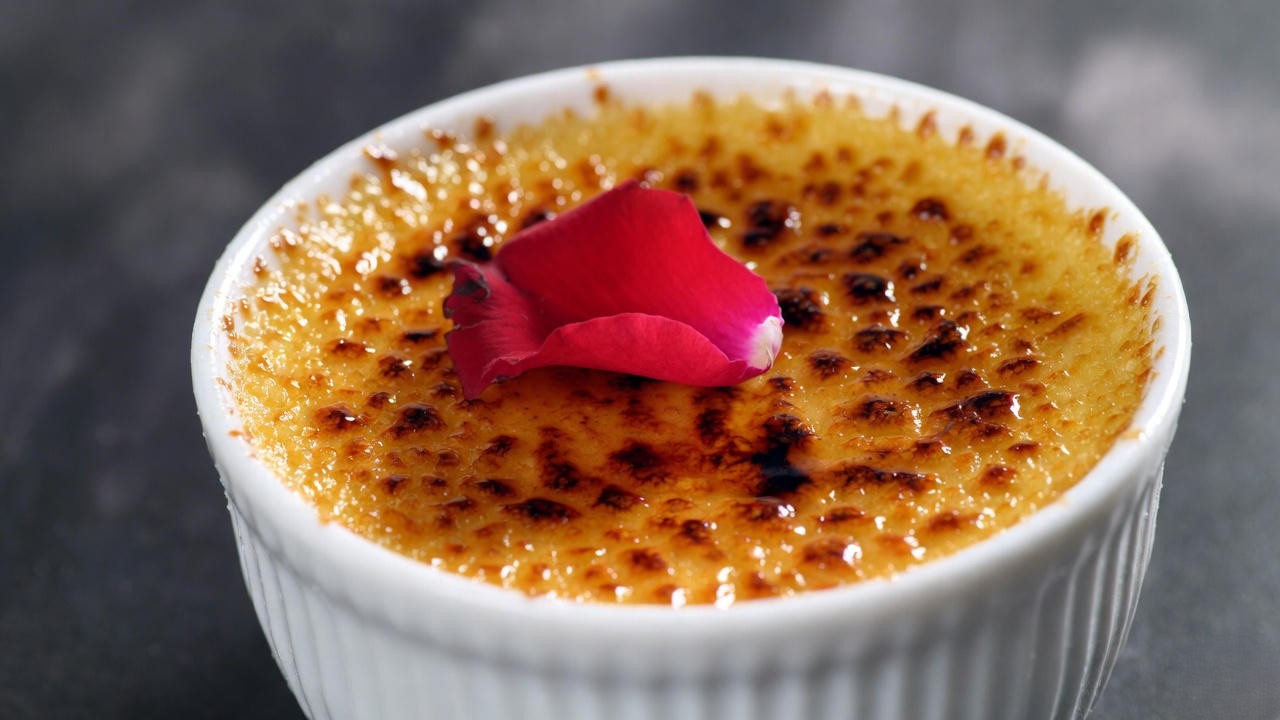 Romantic crème brûlée dessert with rose at Romeo and Juliet Restaurant Buffalo