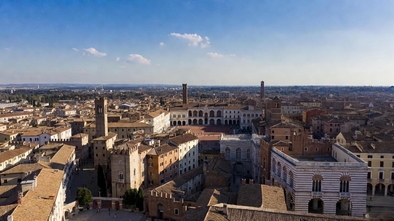 Historic Renaissance street and piazza in Verona, Italy, evoking the feud-torn setting of Romeo and Juliet.