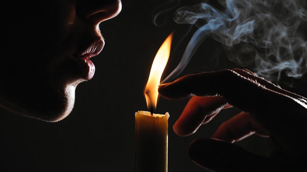 Extinguishing candle representing life's brief candle in Shakespeare's Macbeth