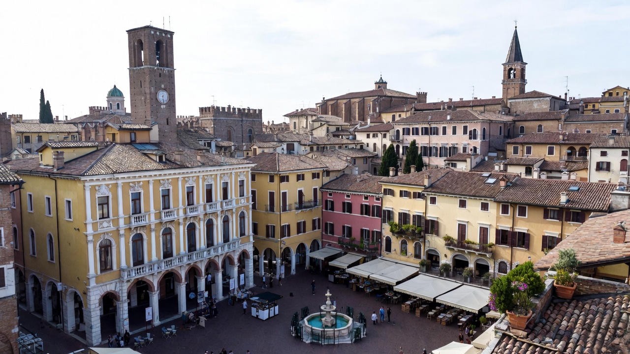 Piazza delle Erbe historic square in modern Verona, a key location tied to Romeo and Juliet tourism