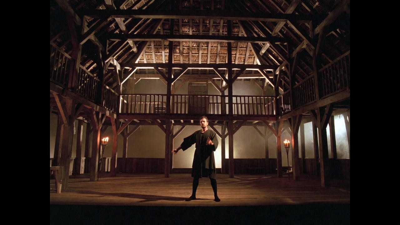 The Chorus narrating on an Elizabethan stage in Shakespeare's Henry V