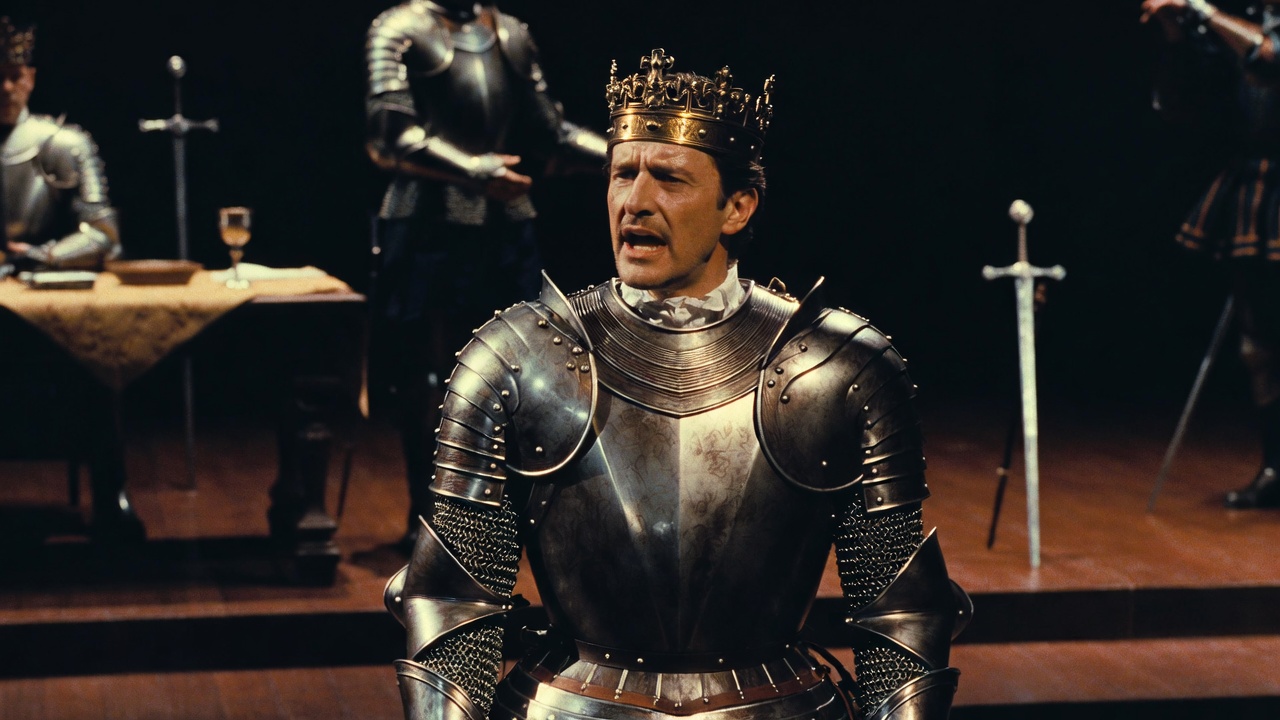 Actor performing as Shakespeare's legendary King Henry V on stage contrasting historical reality