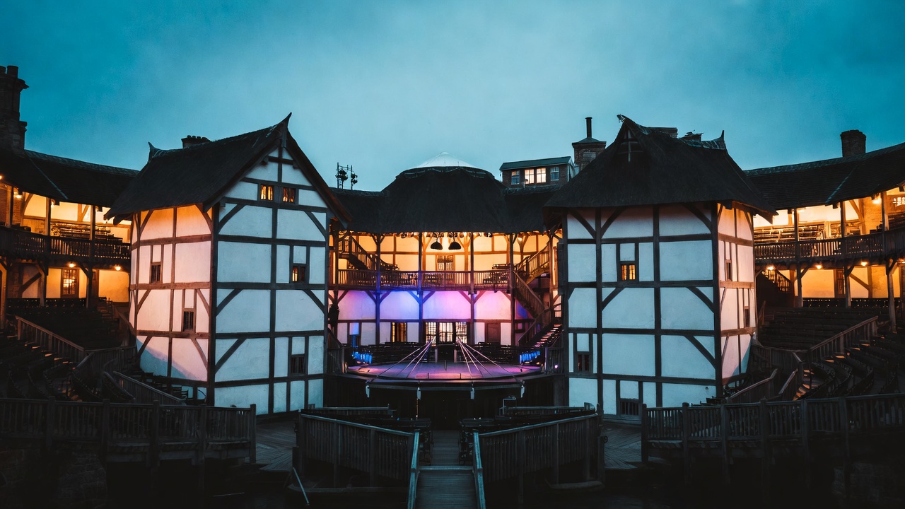 Shakespeare's Globe Theatre at dusk, home of the 2024 bilingual Antony and Cleopatra production