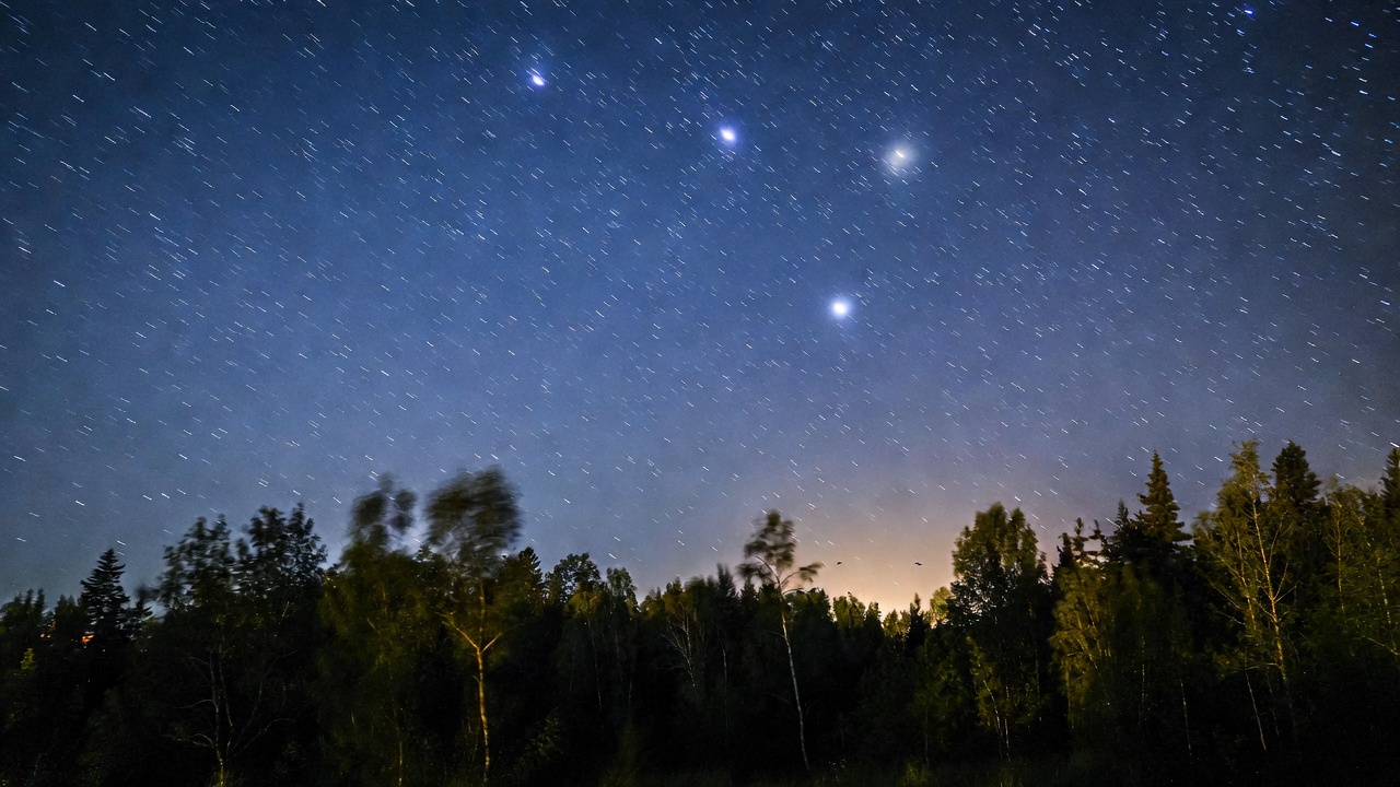 Starry twilight sky with birds in flight representing soft eternal presence and healing comfort