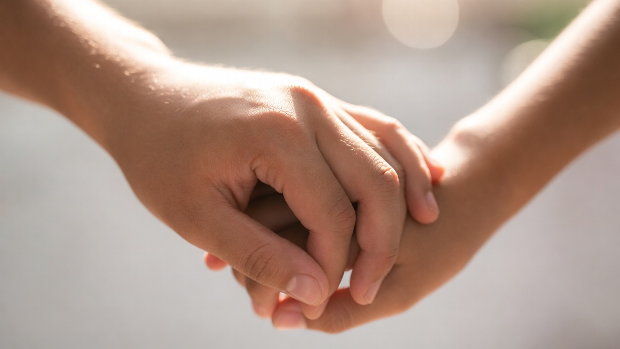 Group of diverse Texas teens discussing relationships and boundaries in park setting for safe dating under age of consent laws