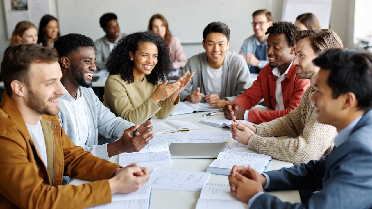 Diverse adult students discussing literature in RCC Hamlet NC classroom group setting
