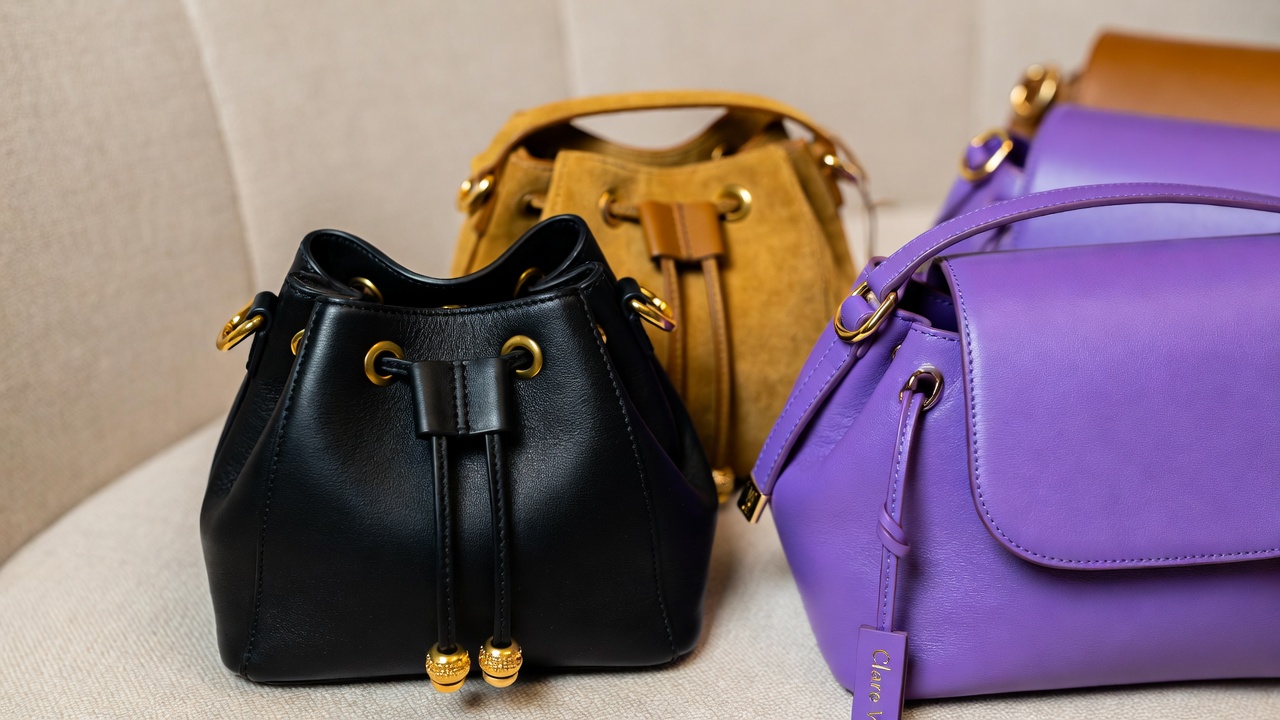 Collection of Clare V Henri Petit mini bags in various leathers and colors, highlighting owner-favorite variations and quality.