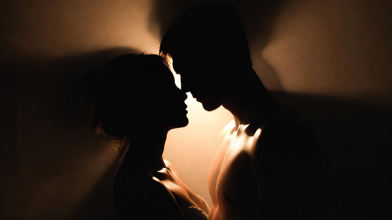 Symbolic lovers embrace in light and darkness contrast, illustrating Romeo and Juliet's central motif of hidden love