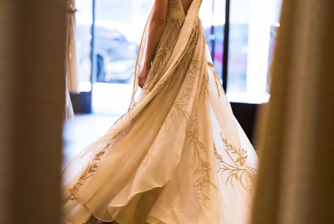 Lovers and Friends gown in elegant plissé fabric showcasing modern luxury and effortless drape