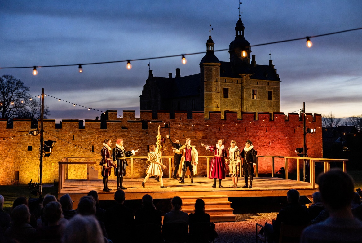 Live Shakespeare performance at the annual Elsinore Festival against Kronborg Castle backdrop