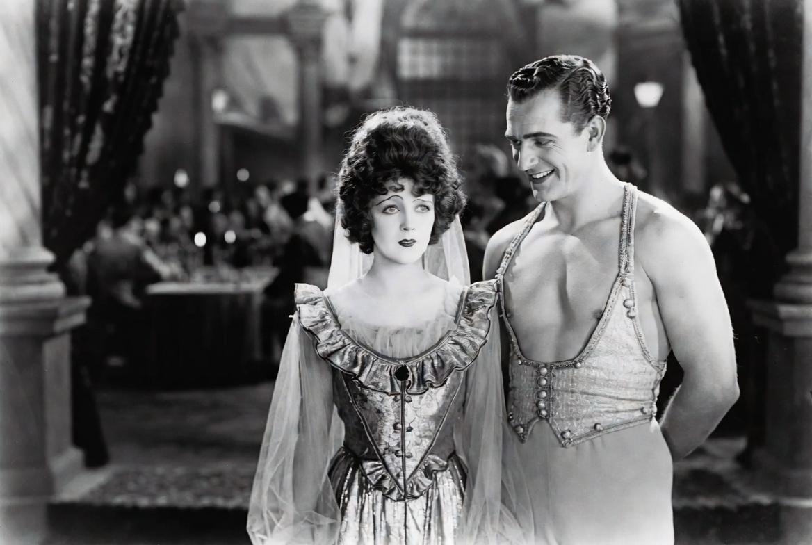 Mary Pickford as Katherina winking at the audience during the famous submission speech in the 1929 silent film adaptation.