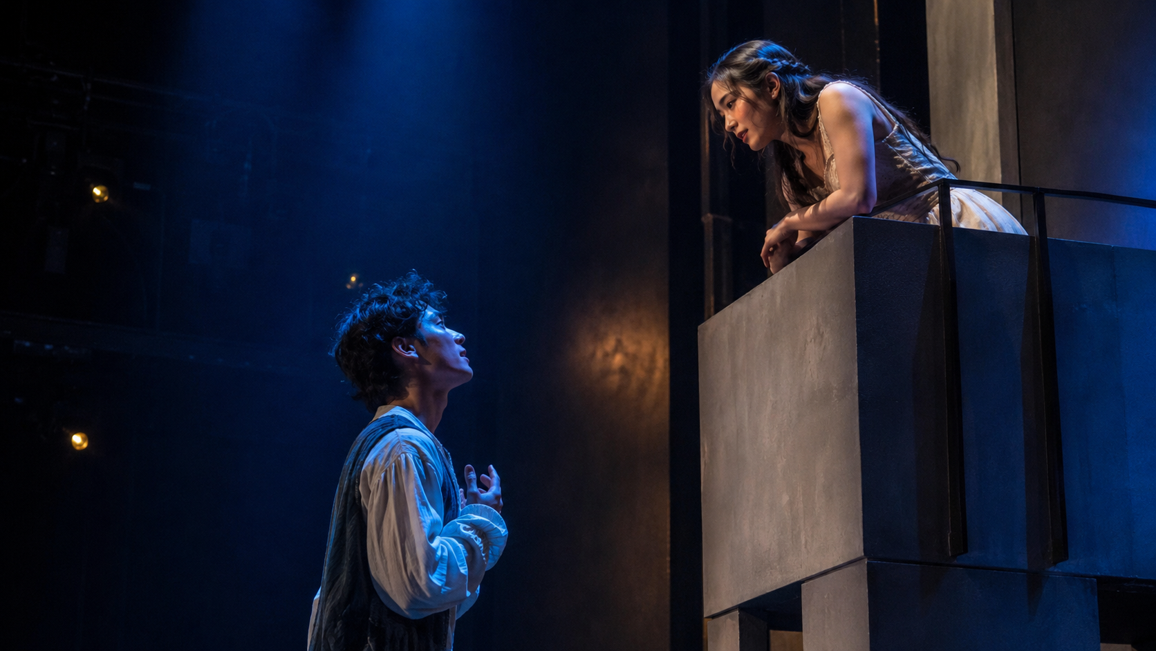 Modern stage performance of Romeo and Juliet iconic balcony scene