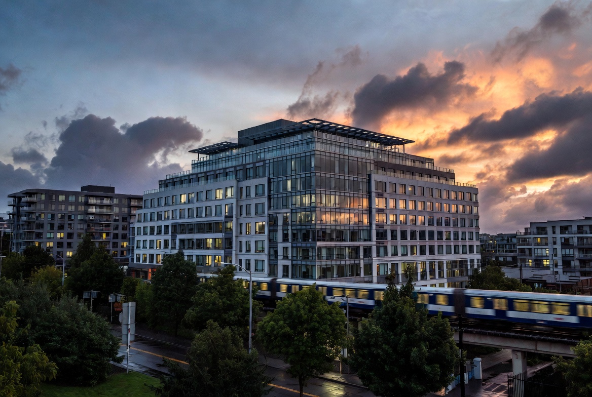 Modern Othello Station apartments exterior with light rail and park views in Seattle