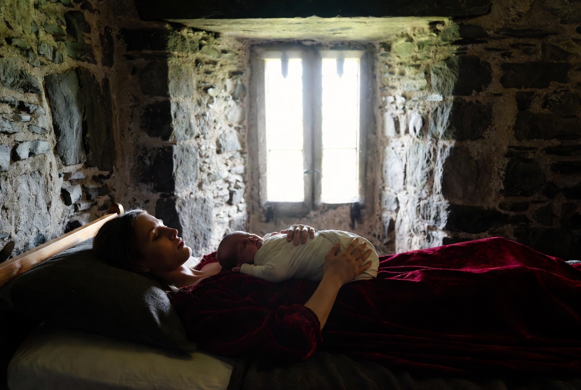 A tender medieval photograph of Mary Bohun and her infant son, Prince Hal, inside Monmouth Castle after his birth.
